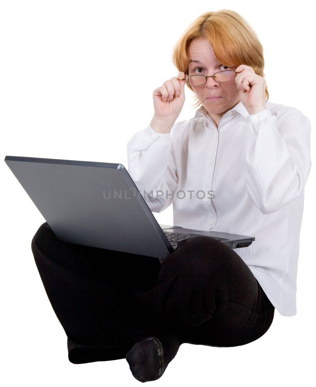 The woman sitting on a floor with the laptop