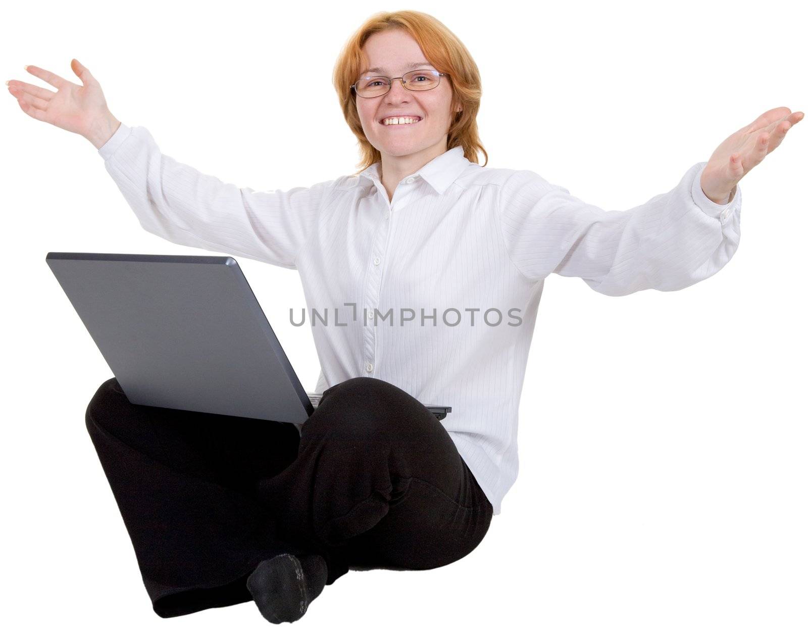 The woman sitting on a floor with the laptop on white