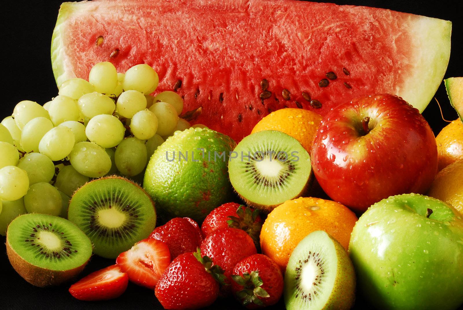 Colorful fresh group of fruits for a balanced diet. Black background. Look at my gallery for more fresh fruits and vegetables.