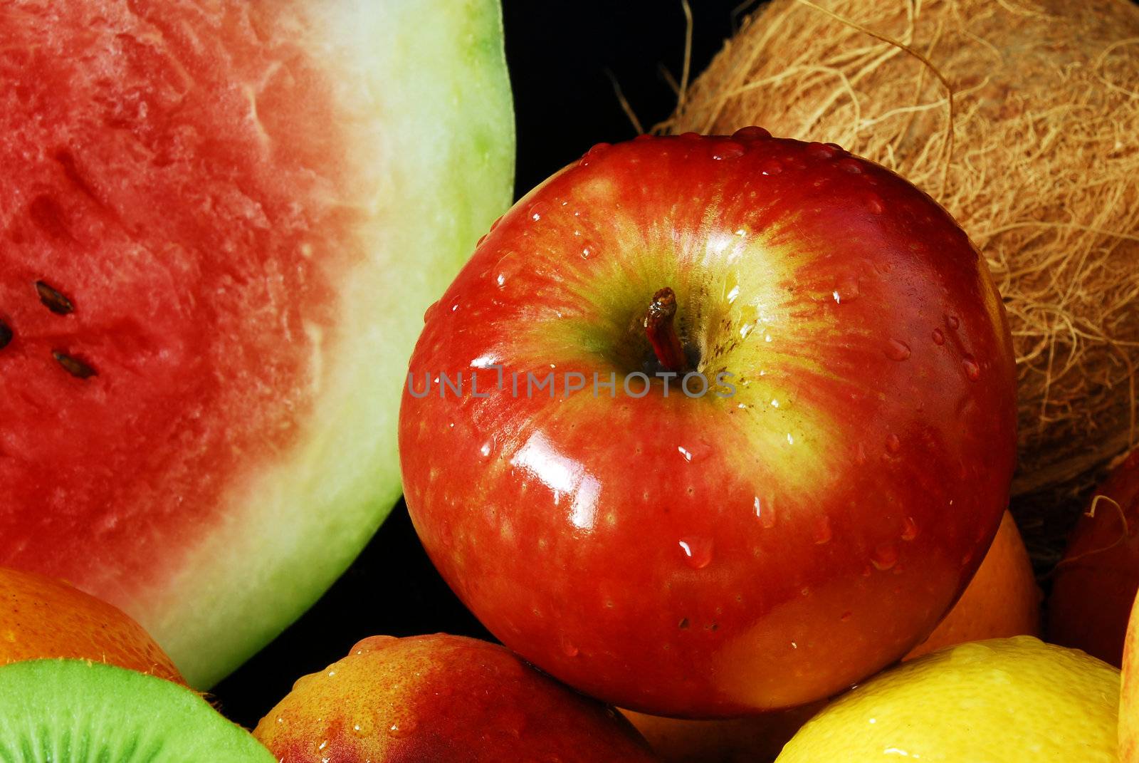 Colorful fresh group of fruits for a balanced diet. Black background. Look at my gallery for more fresh fruits and vegetables.