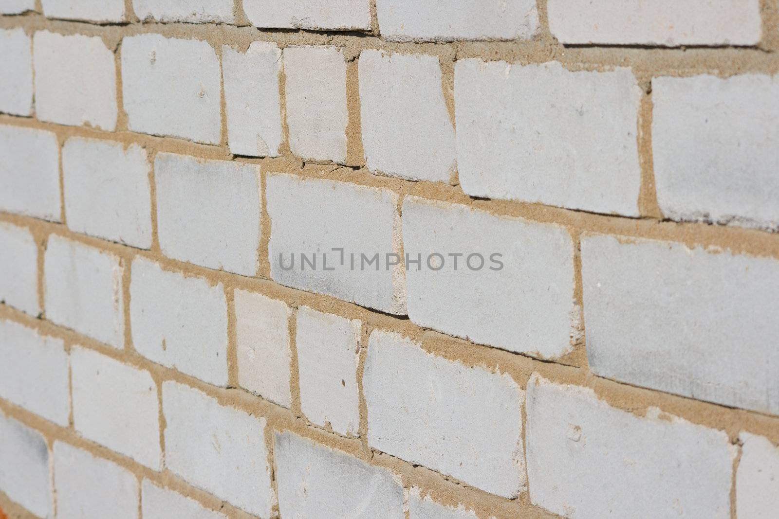Texture of a wall of the house from a white brick. A background