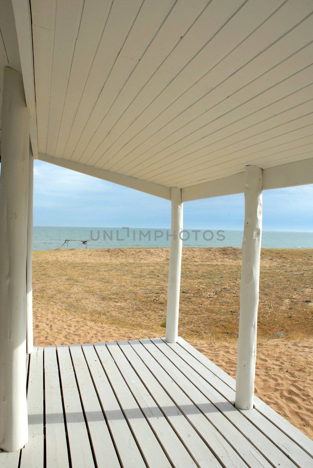 Serenity white porch at seashore by cienpies