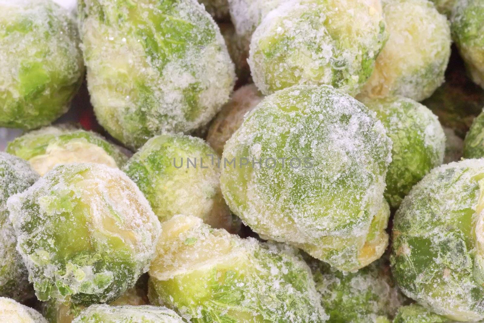 Frozen Brussels sprouts in detail as background
