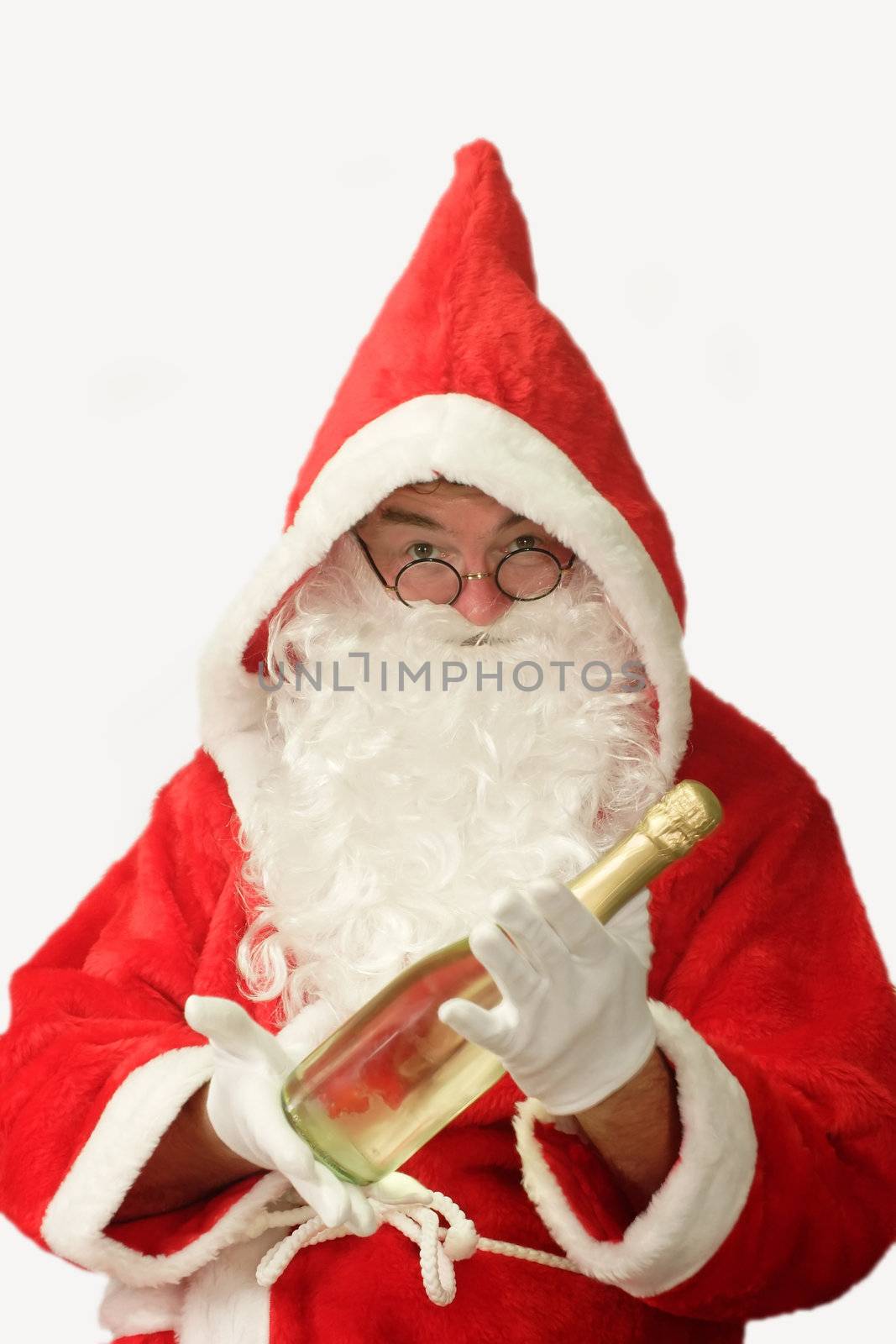 Male caucasian model of santa claus holding a bottle of champaigne - isolated on white background