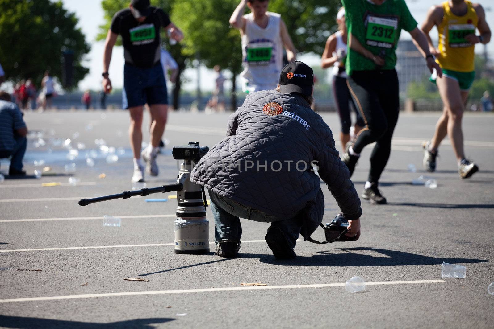 Professional photographer at Riga International Marathon by ints