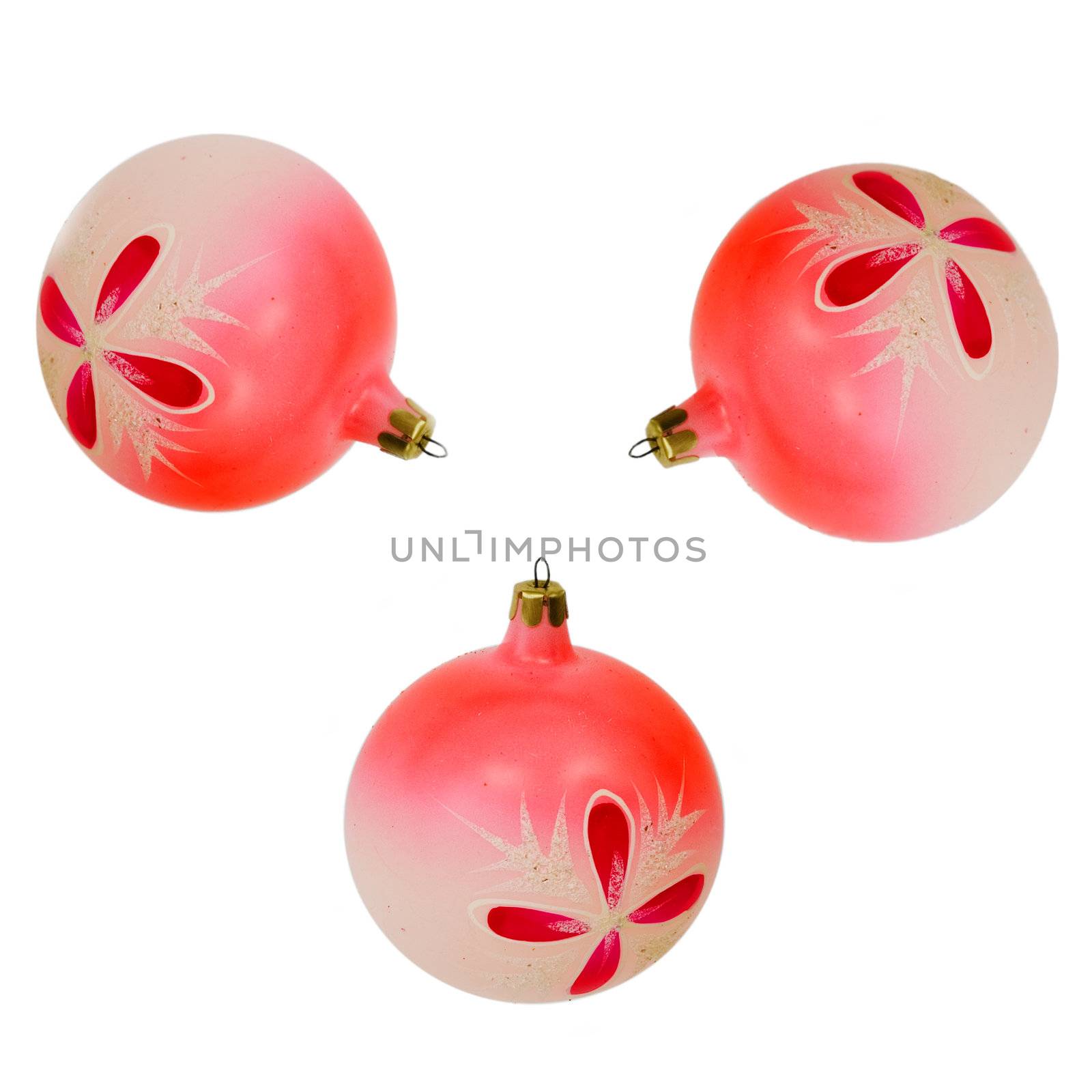 Three Cristmas tree rosy balls on the white background