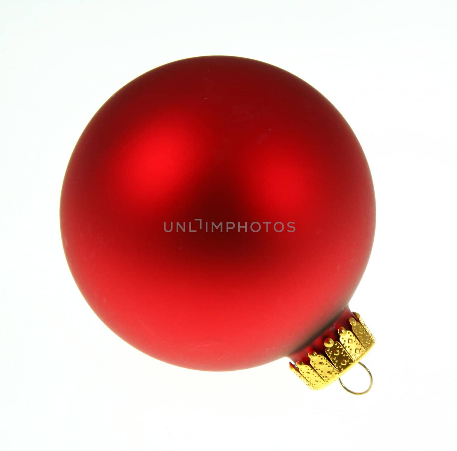 A single isolated red Christmas sitting bauble.
