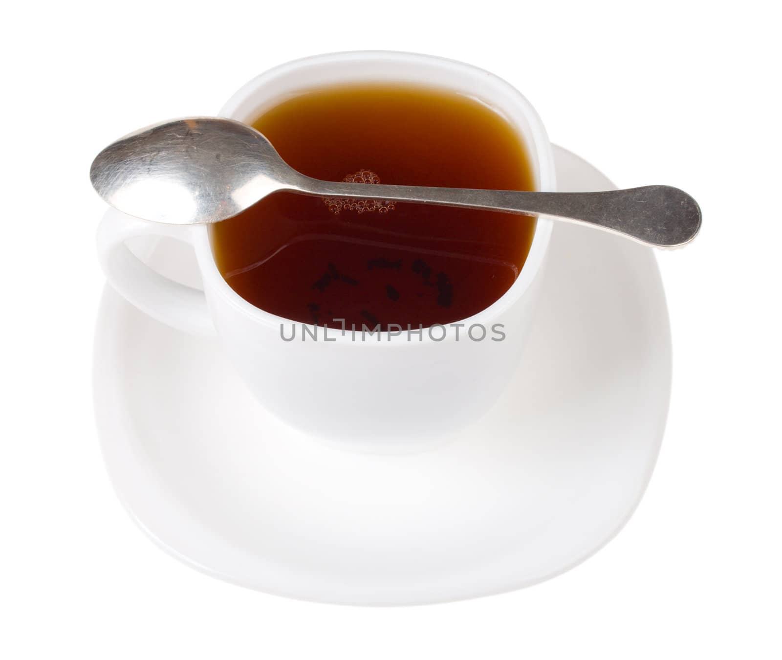 cup and spoon with black tea by Alekcey