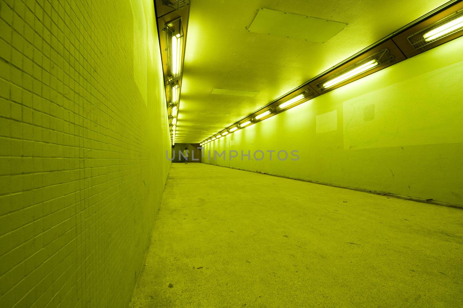 long tunnel with lamps and nobody walking