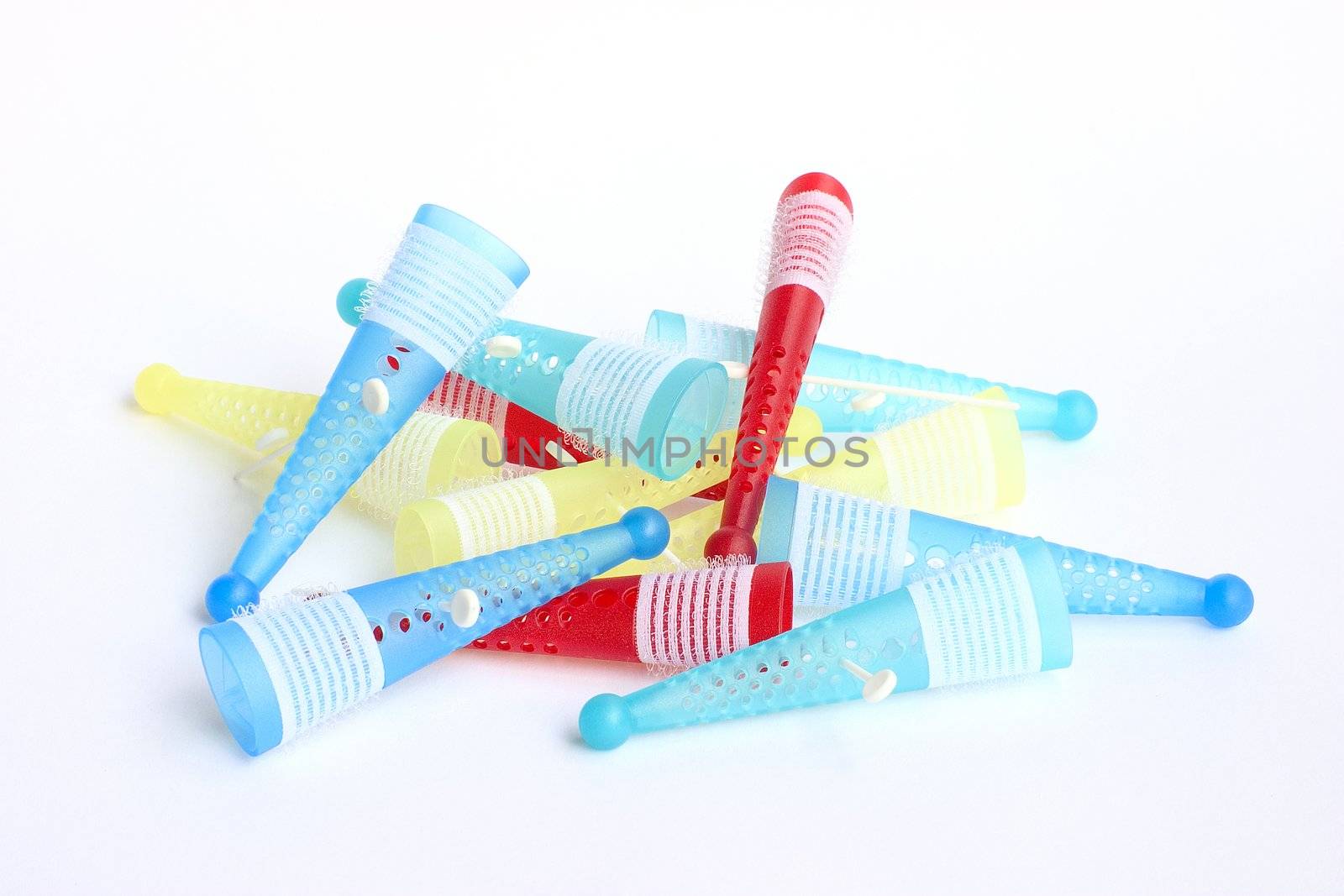 Colored hair rollers isolated on a white background