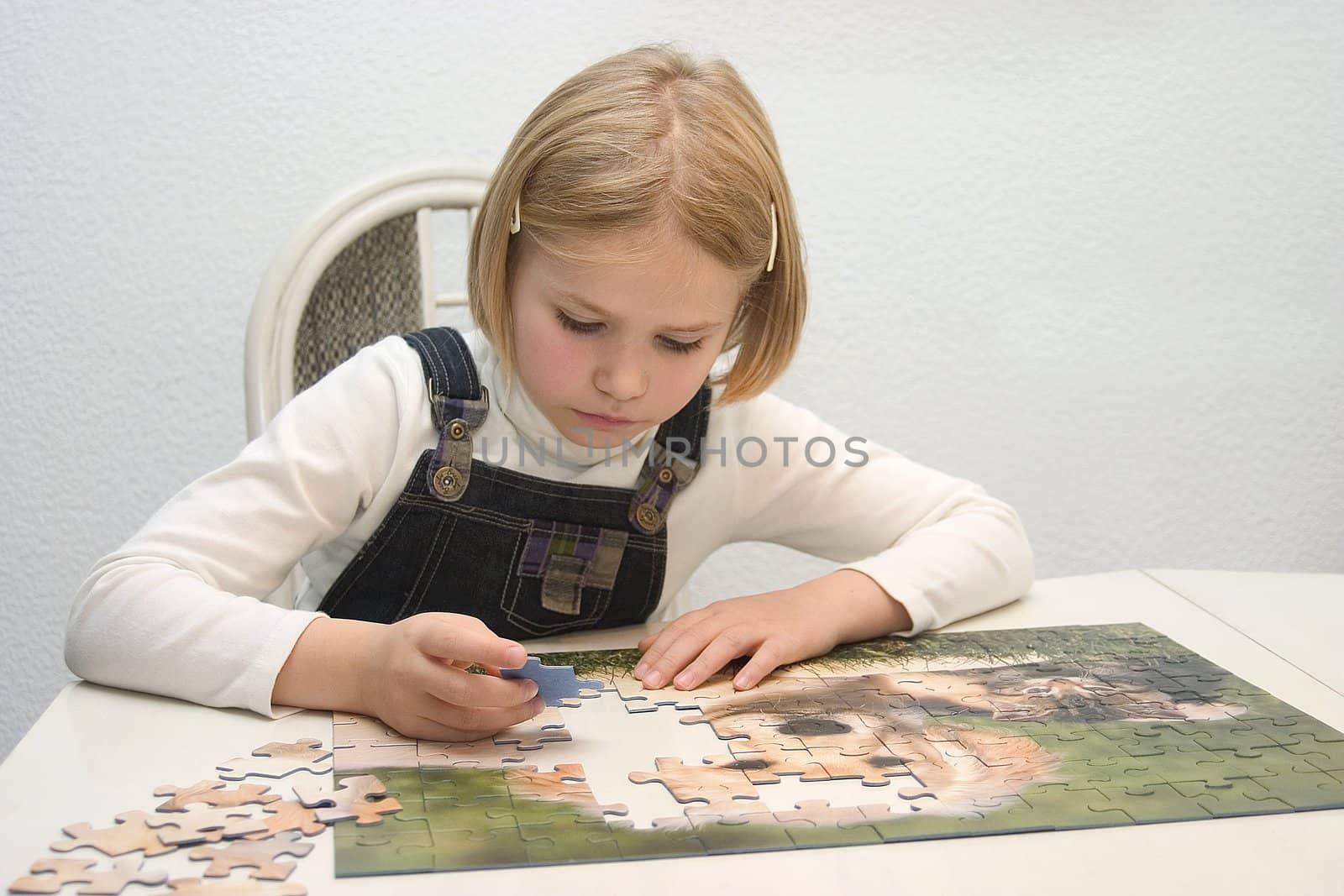 Child composes Jigsaws by miradrozdowski