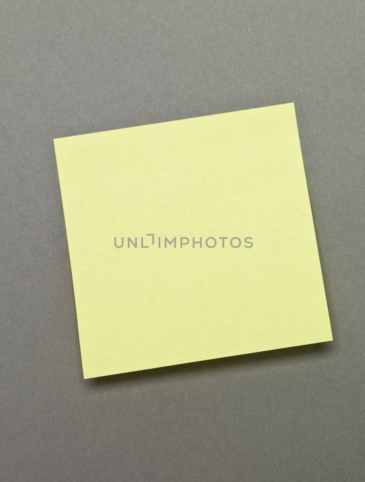 Yellow Adhesive Note on grey background