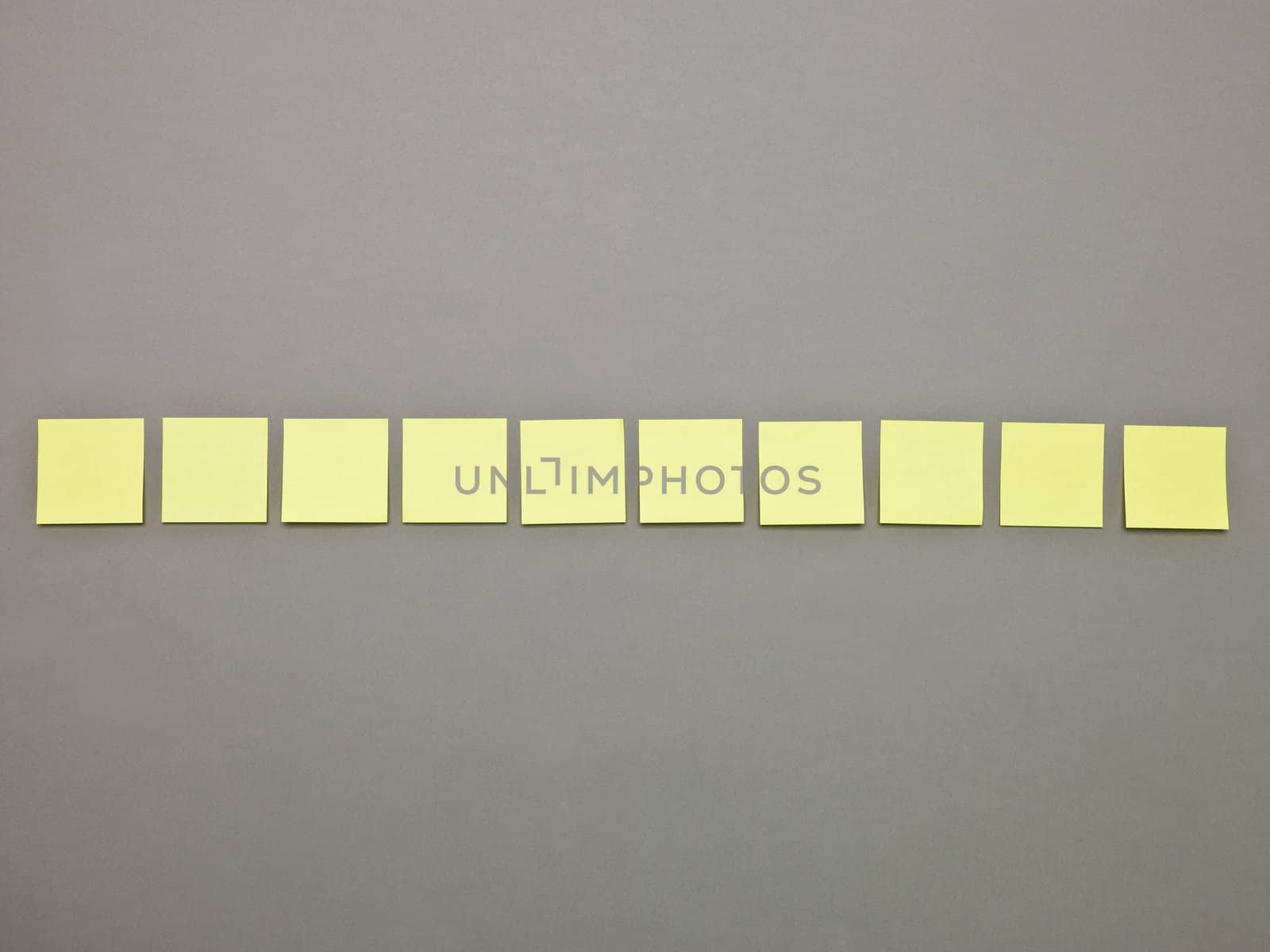 Yellow Adhesive Notes in a row