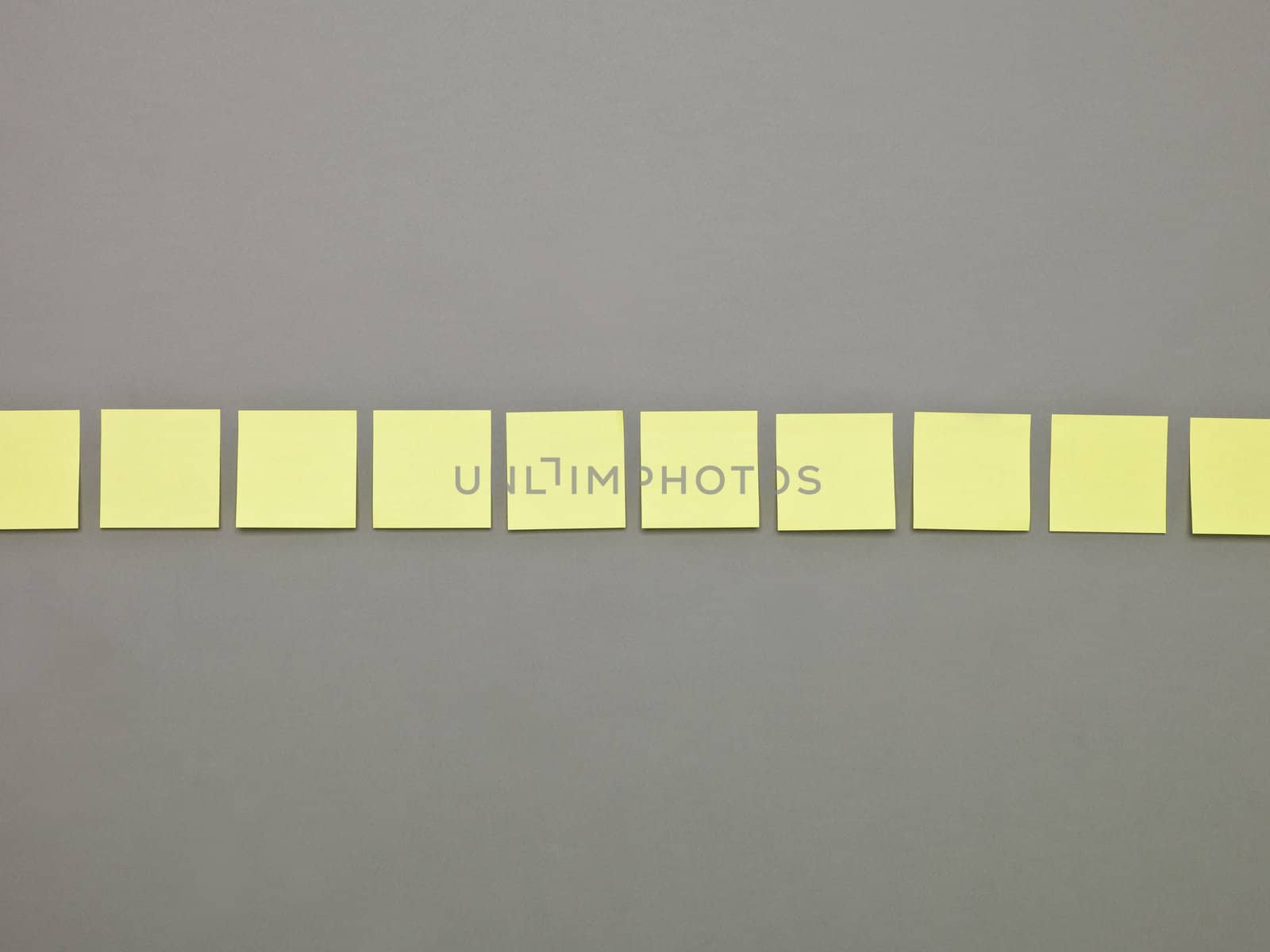 Yellow Adhesive Notes in a row