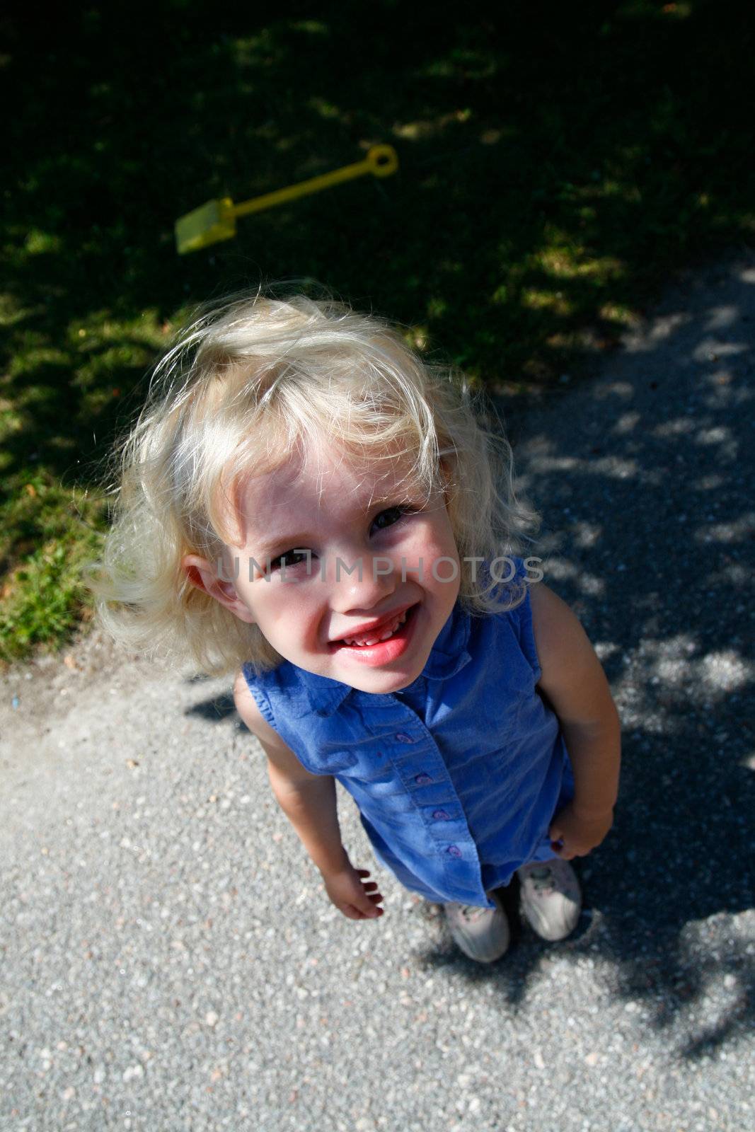 cute happy little girl looking upwards