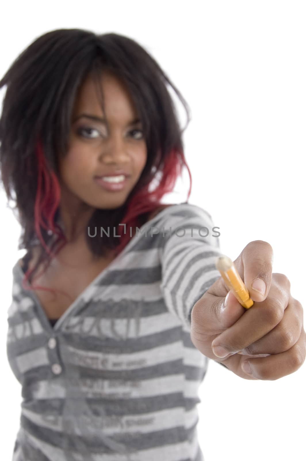 young girl showing pencil on an isolated white background