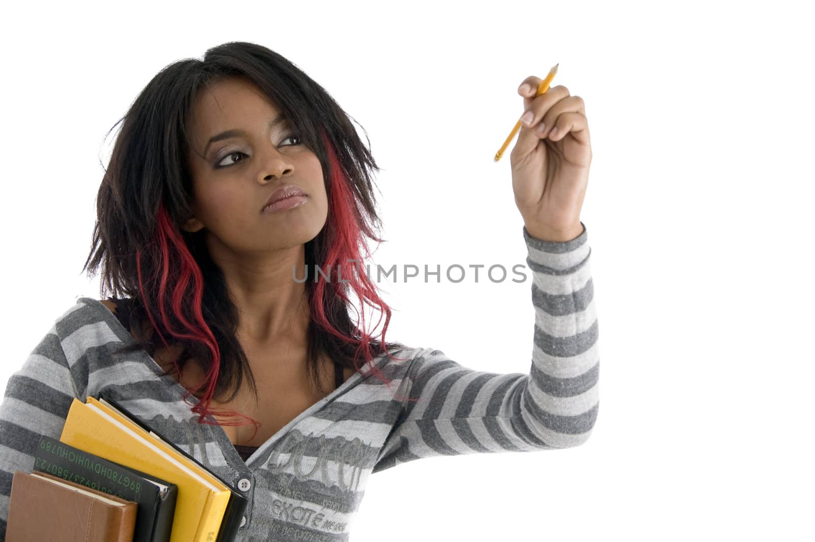 girl with books and looking to pencil against white background