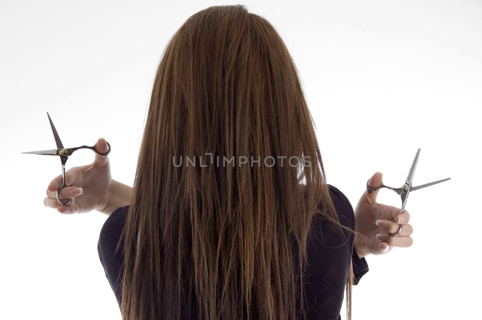 back pose of female with scissors by imagerymajestic