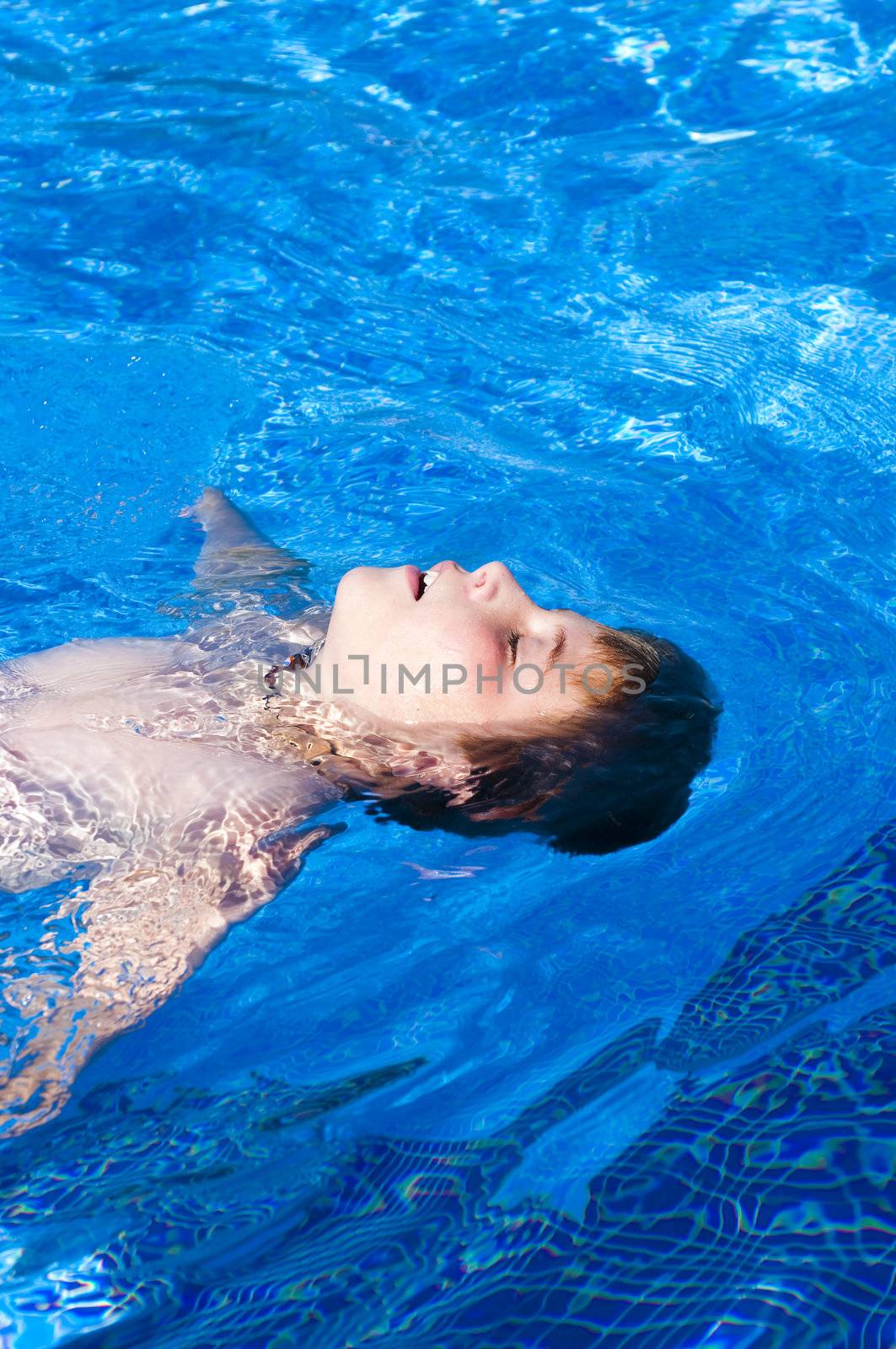 Picture of a boy on a swimming pool