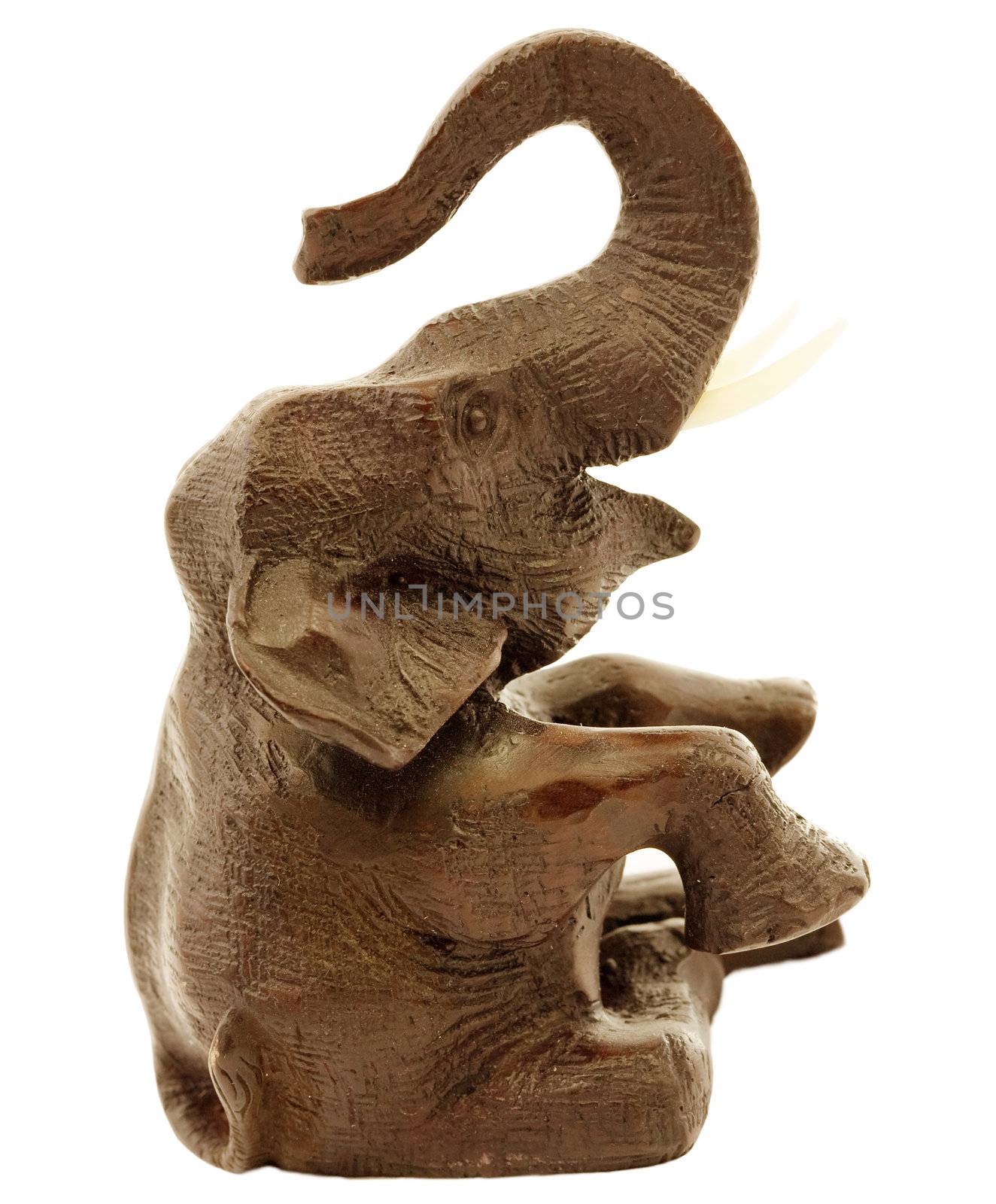 Deep-brown statuette of elephant a white background