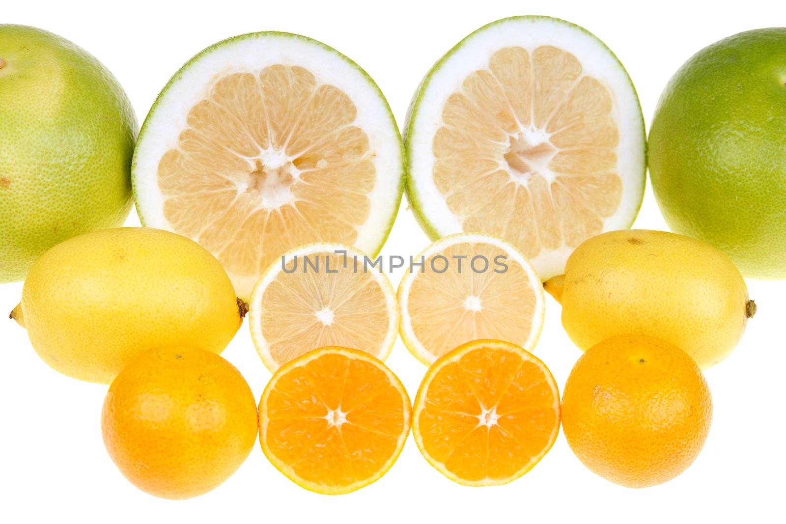  Big green grapefruits,lemon and mandarines close-up on white background