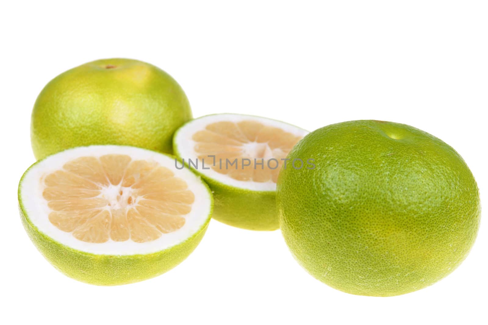  Big green grapefruits close-up on white background