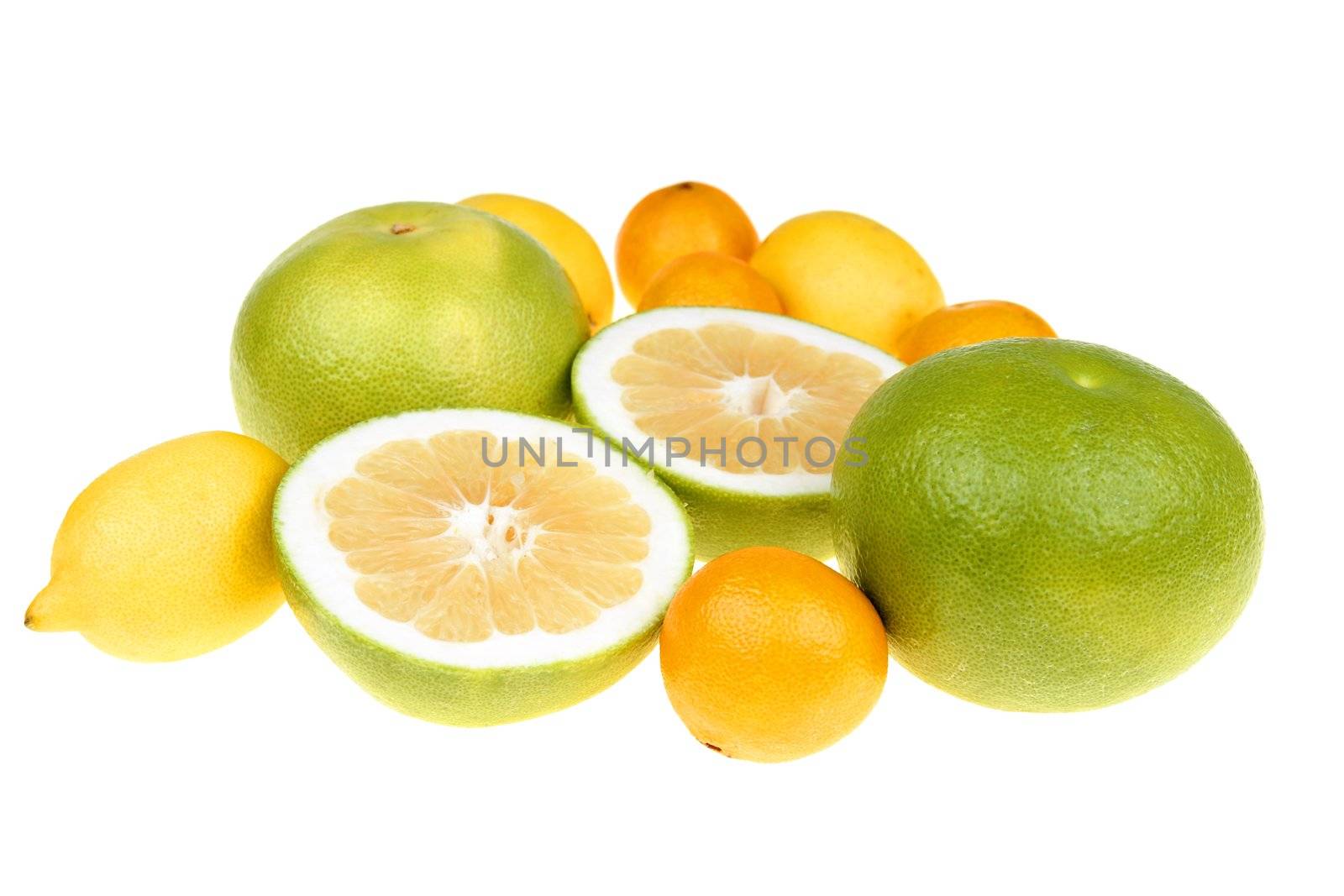  Big green grapefruits,lemon and mandarines close-up on white background