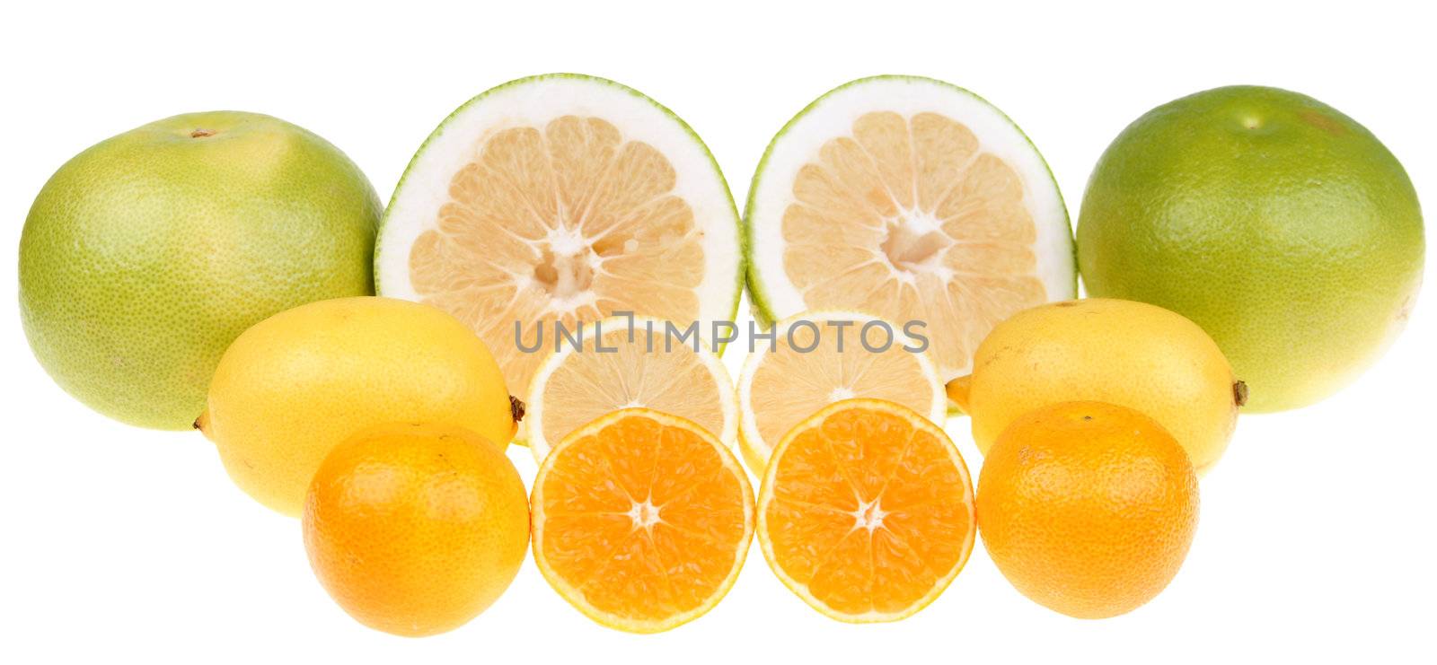  Big green grapefruits,lemon and mandarines close-up on white background