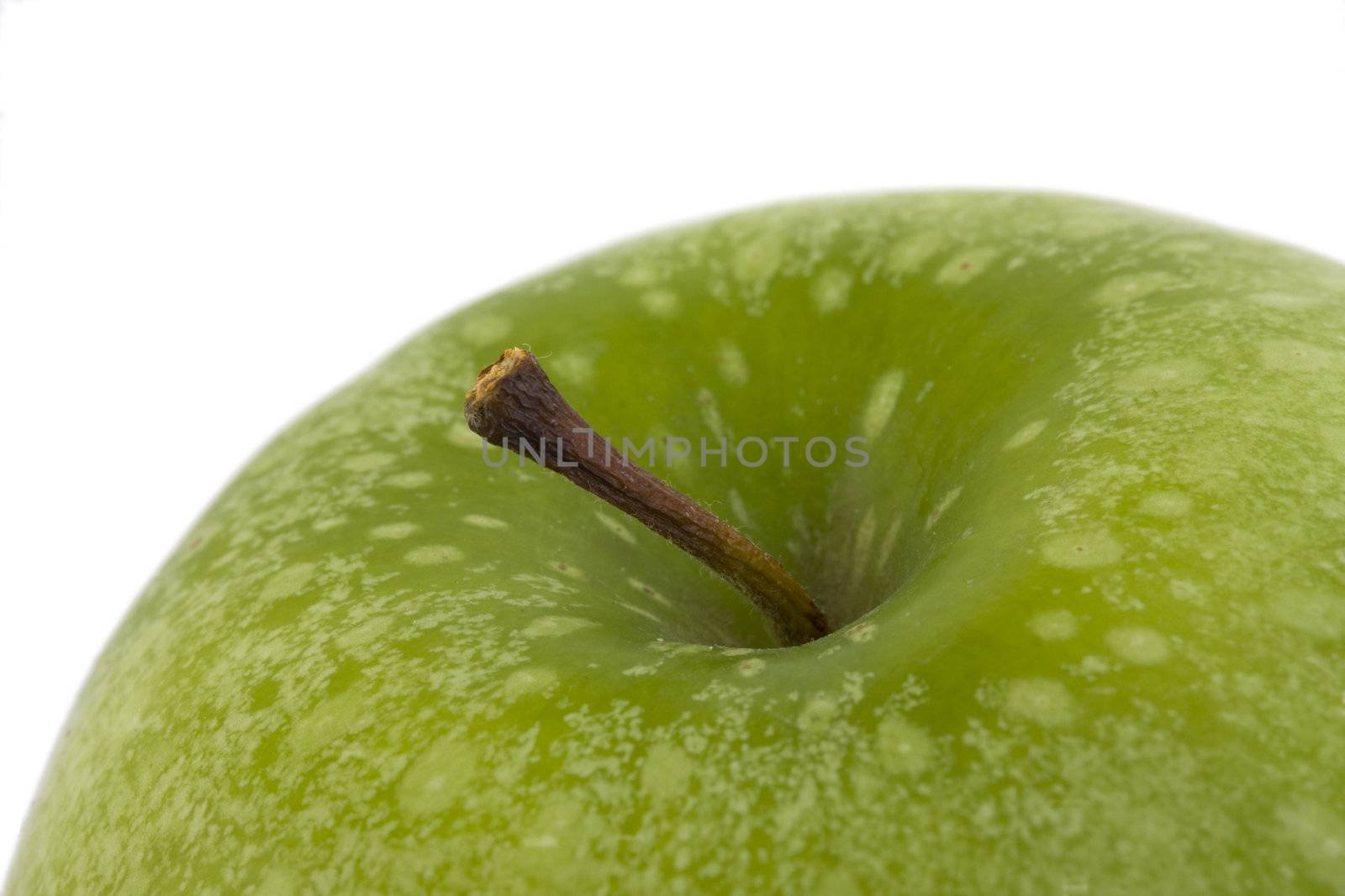 detail of a granny smith apple isolated on white background by bernjuer