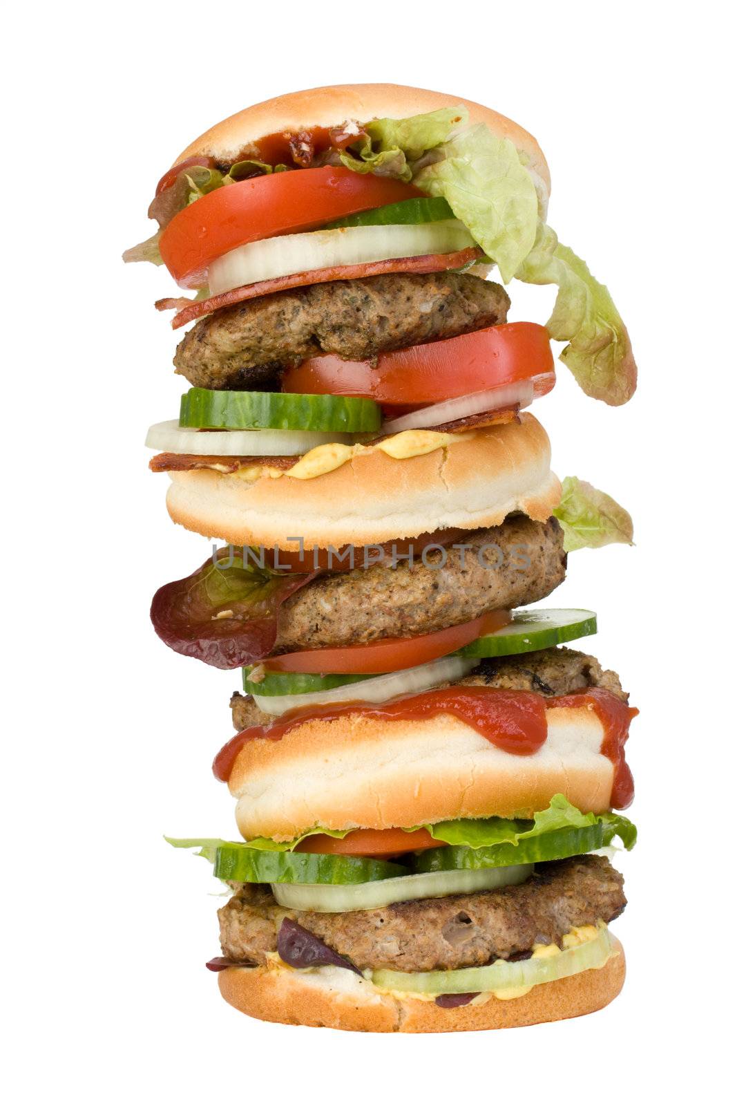a home made quadruple hamburger isolated on white background by bernjuer