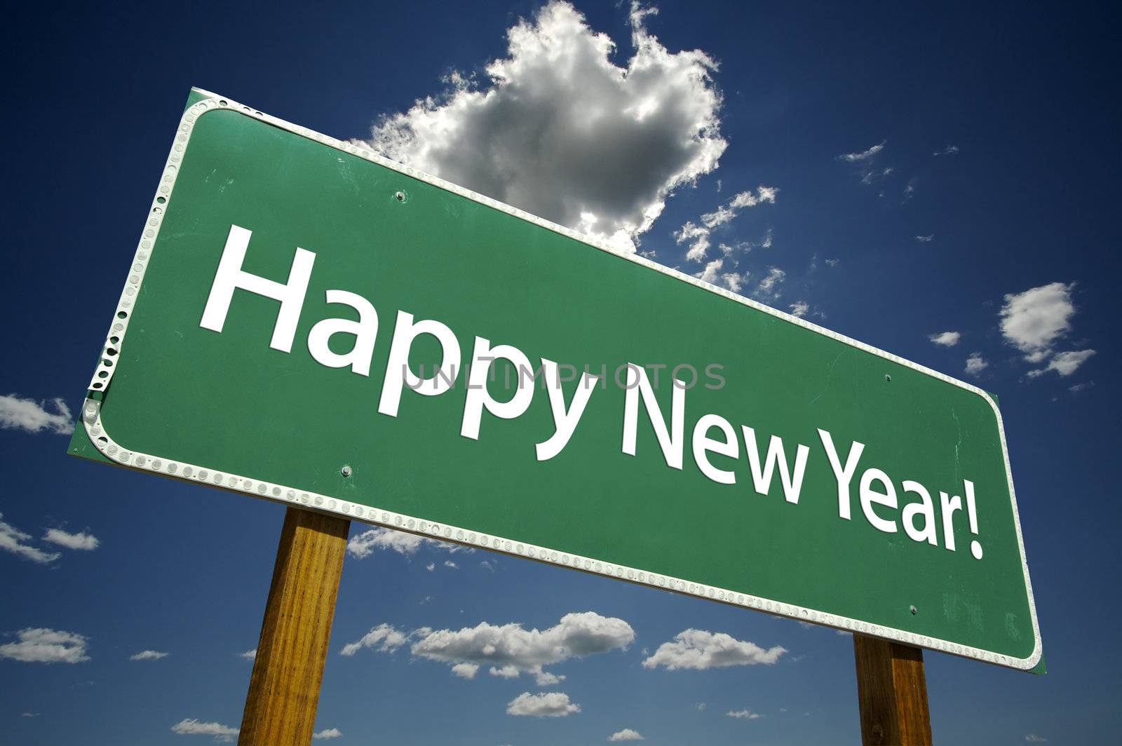 Happy New Year Road Sign with dramatic clouds and sky.