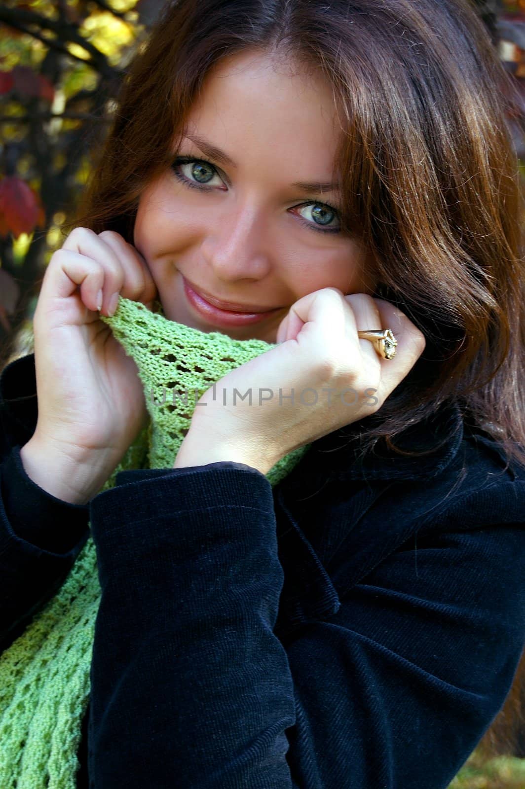 woman with scarf in autumn smiling