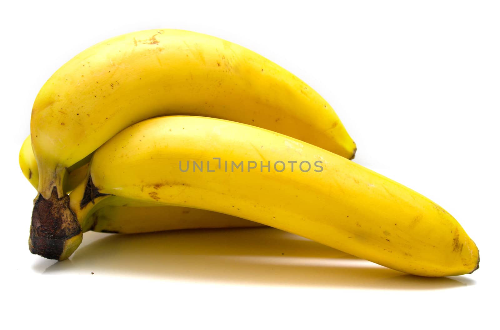 Ripe bananas on the white background. Shallow DOF