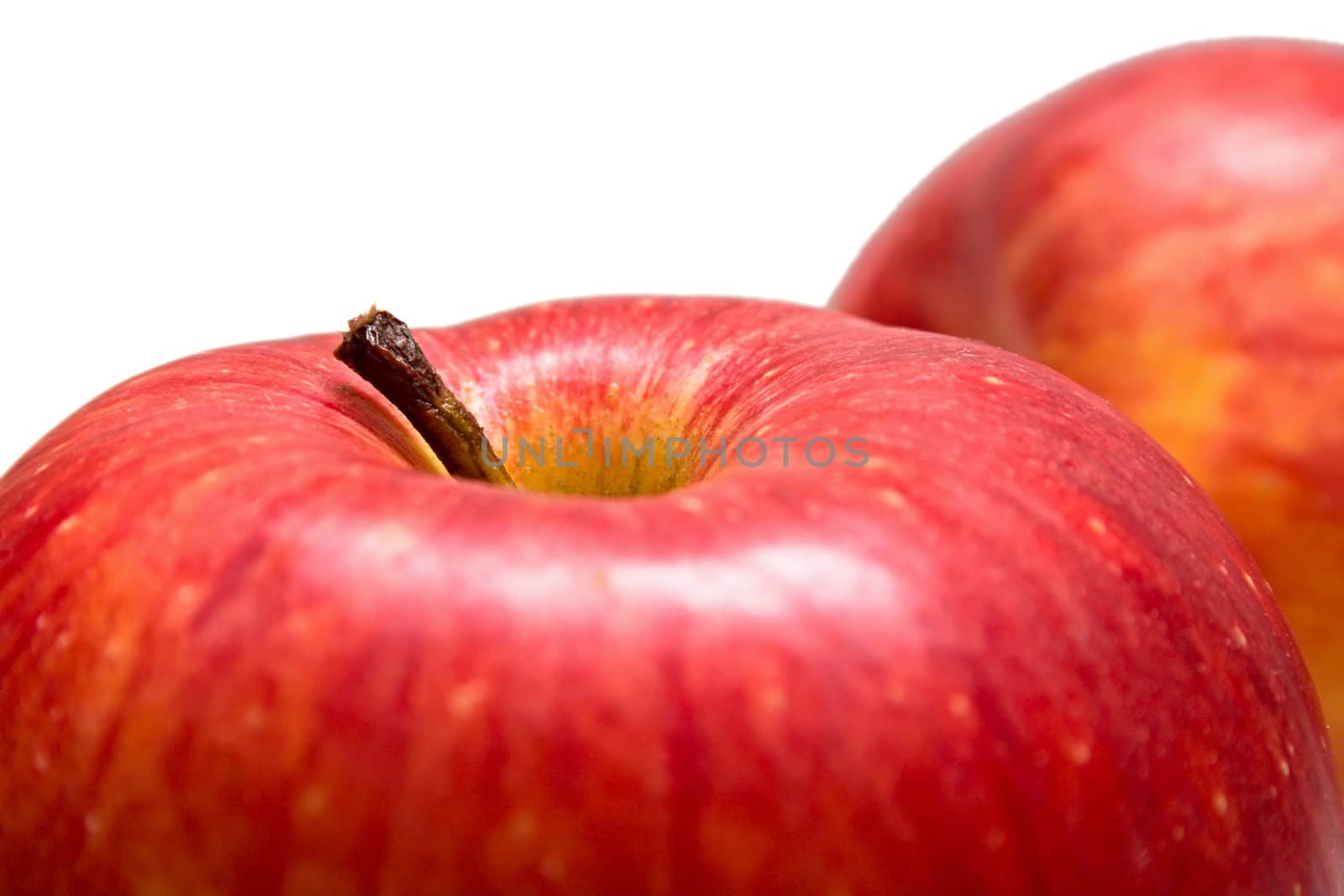 Fragment of red apples on the white background. Isolated. Shallow DOF.