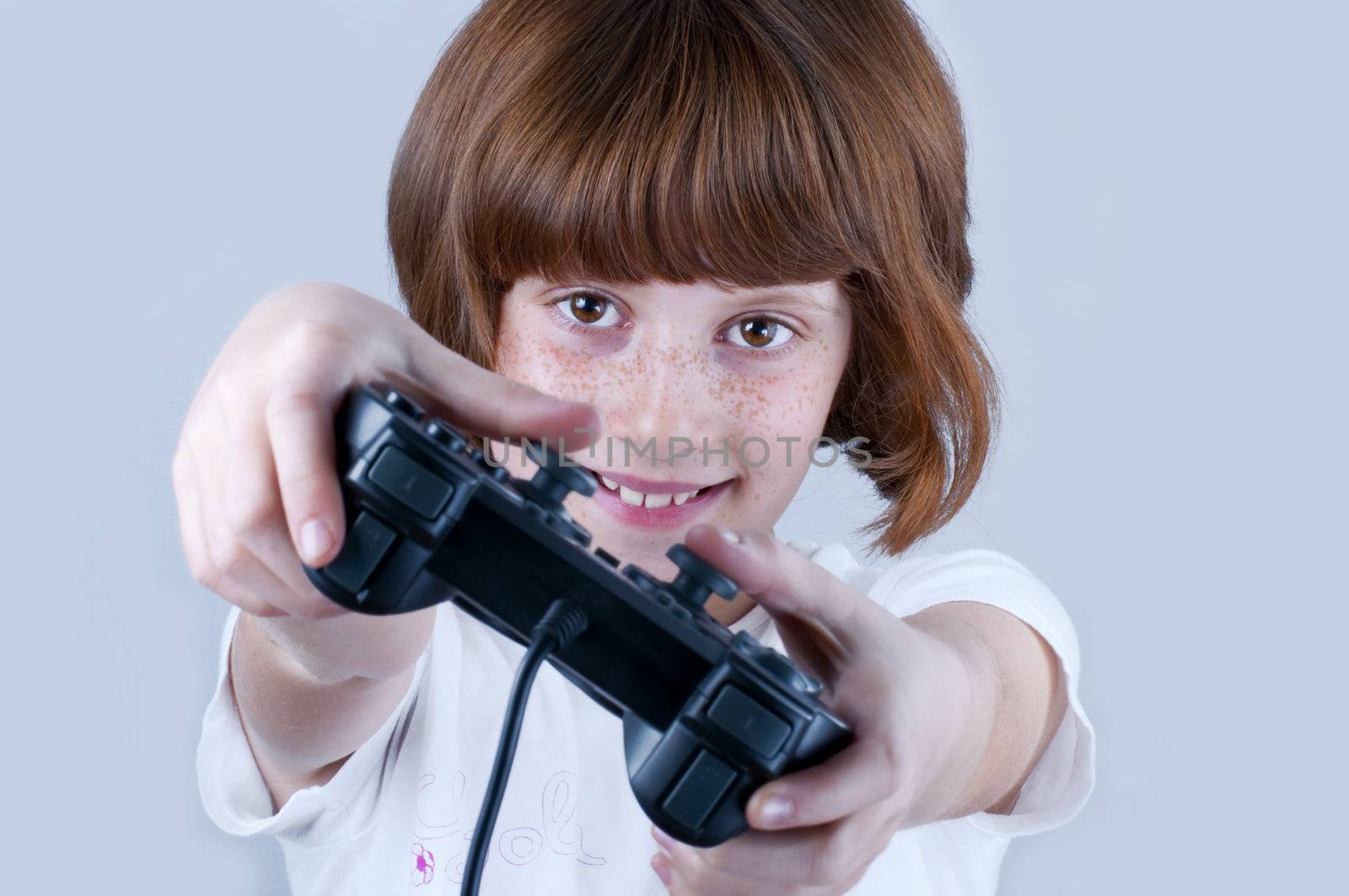 Picture of a young with freckles playing games.