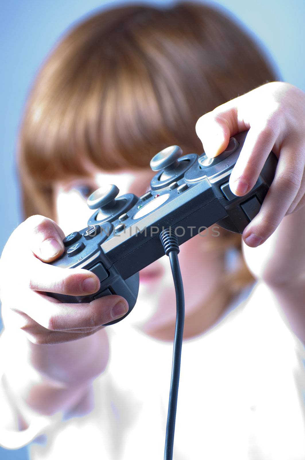 Picture of a young with freckles playing games.