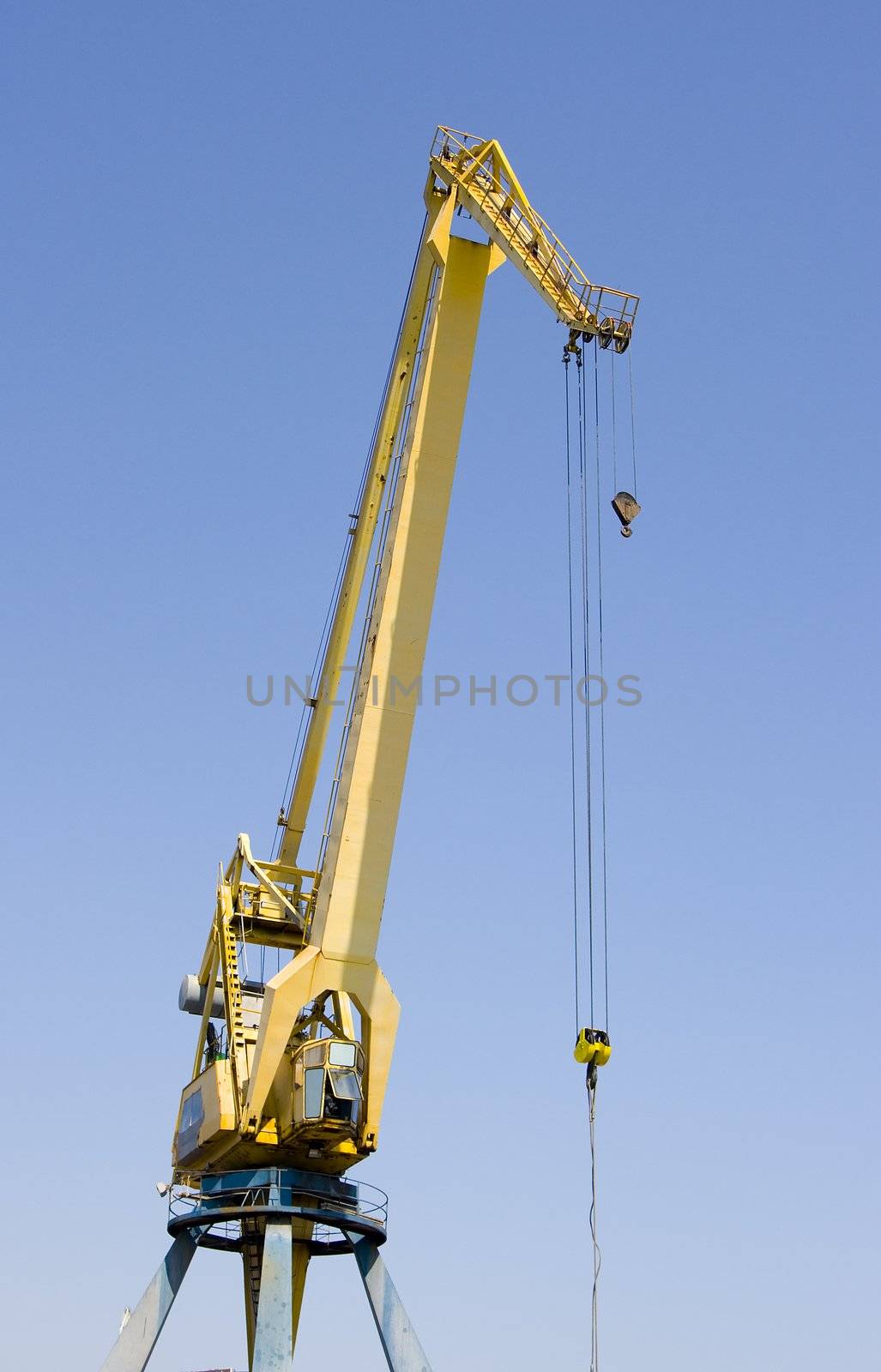 construction industry crane heavy  cargo machinery on a blue background