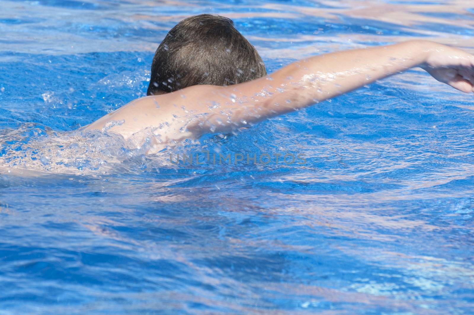 Picture of a boy on a swimming pool