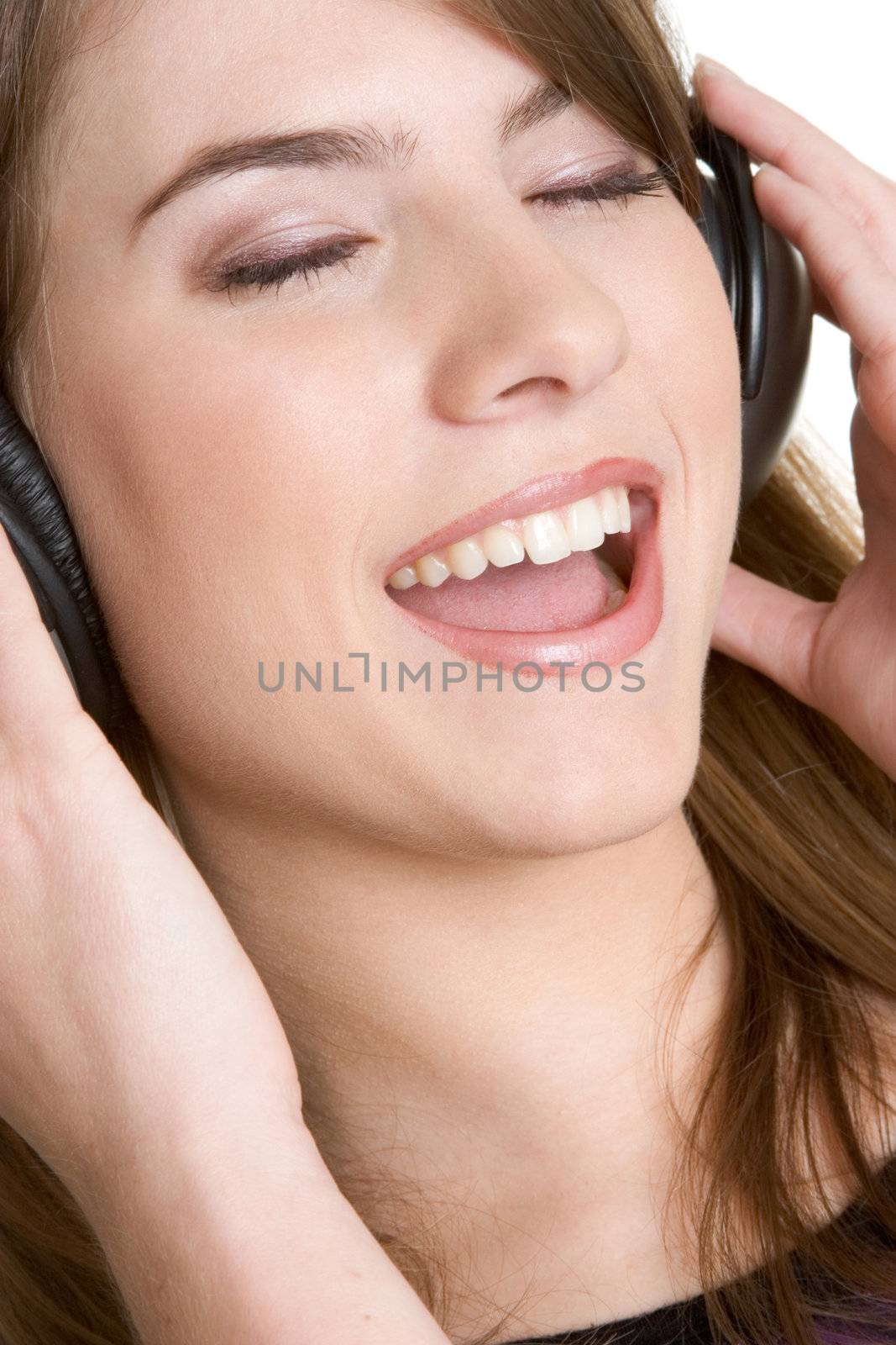 Singing girl wearing music headphones