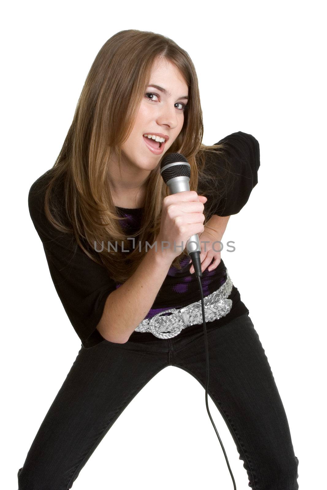 Isolated teen girl singing into microphone