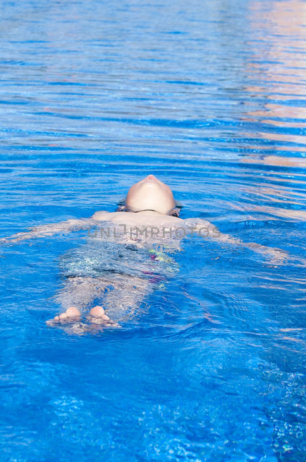 Picture of a boy on a swimming pool by FernandoCortes