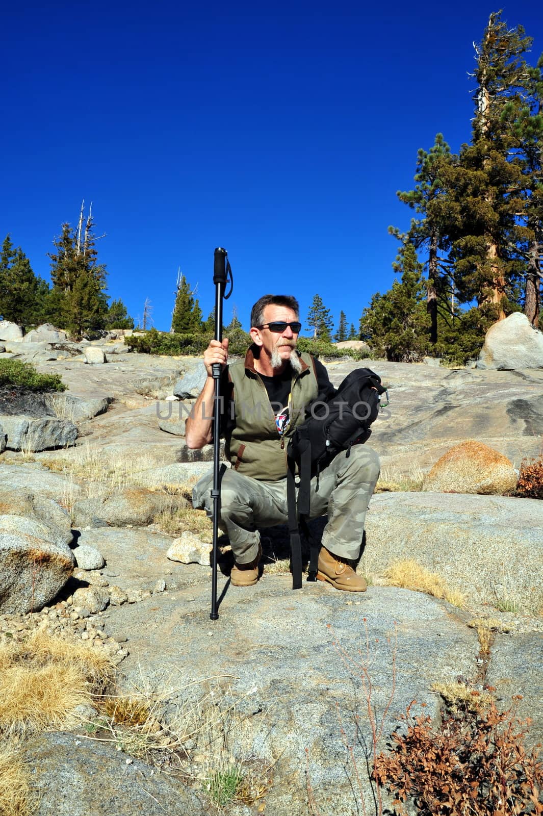 A single male day hiker taking a rest break while hiking in the California Sierra's