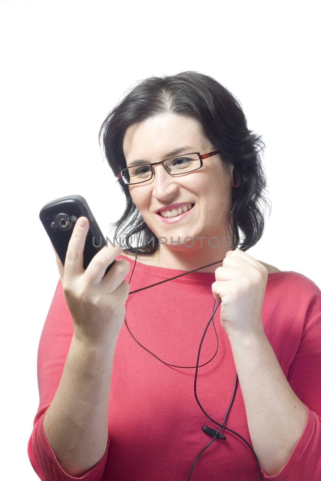 young woman listening, dancing and singing to music in a mp3 device