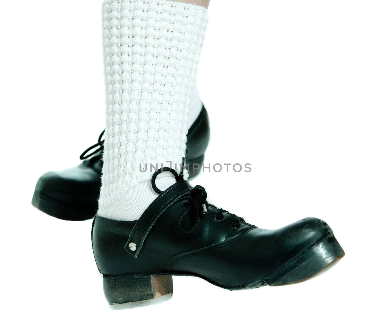 Closeup view of a pair of irish dancing shoes, isolated against a white background.