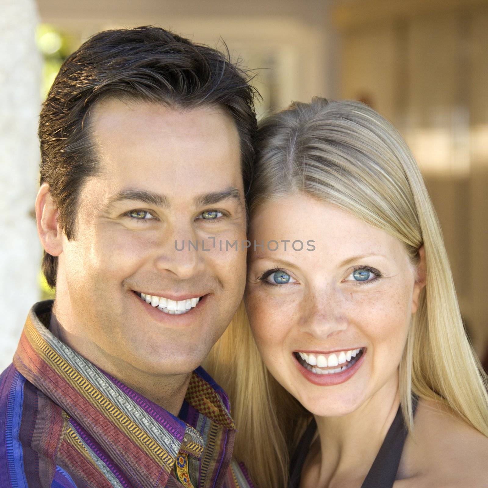 Caucasian couple smiling. by iofoto
