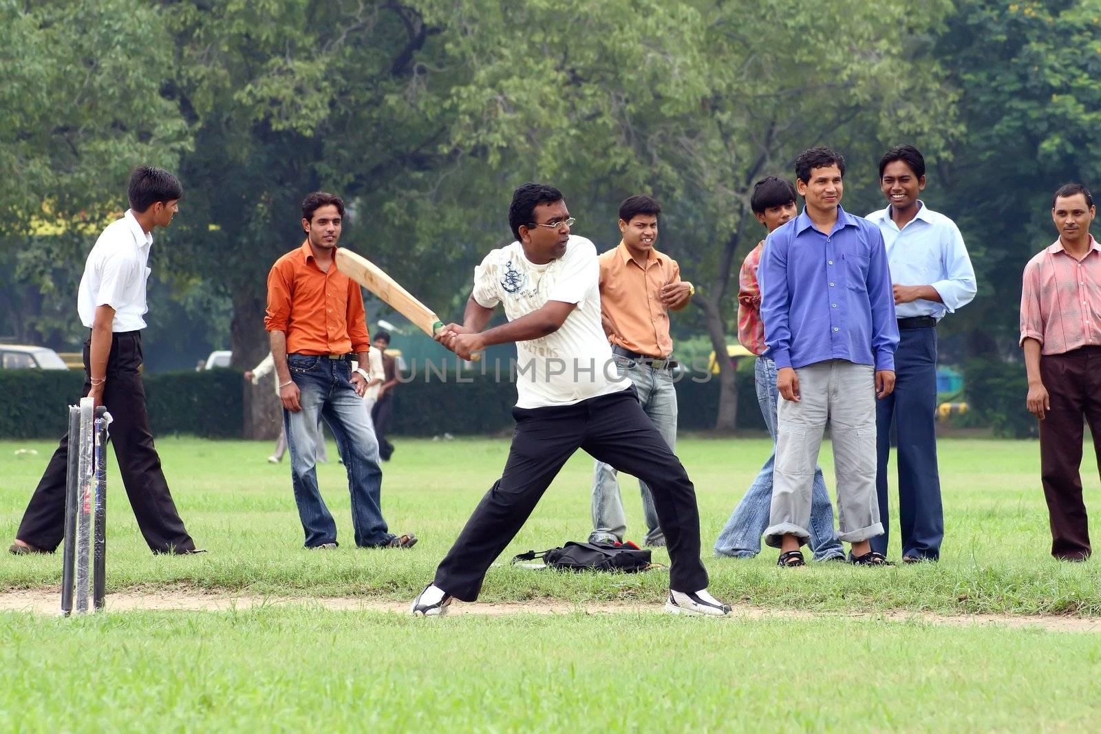 a cricket batsman in action during a cricket match