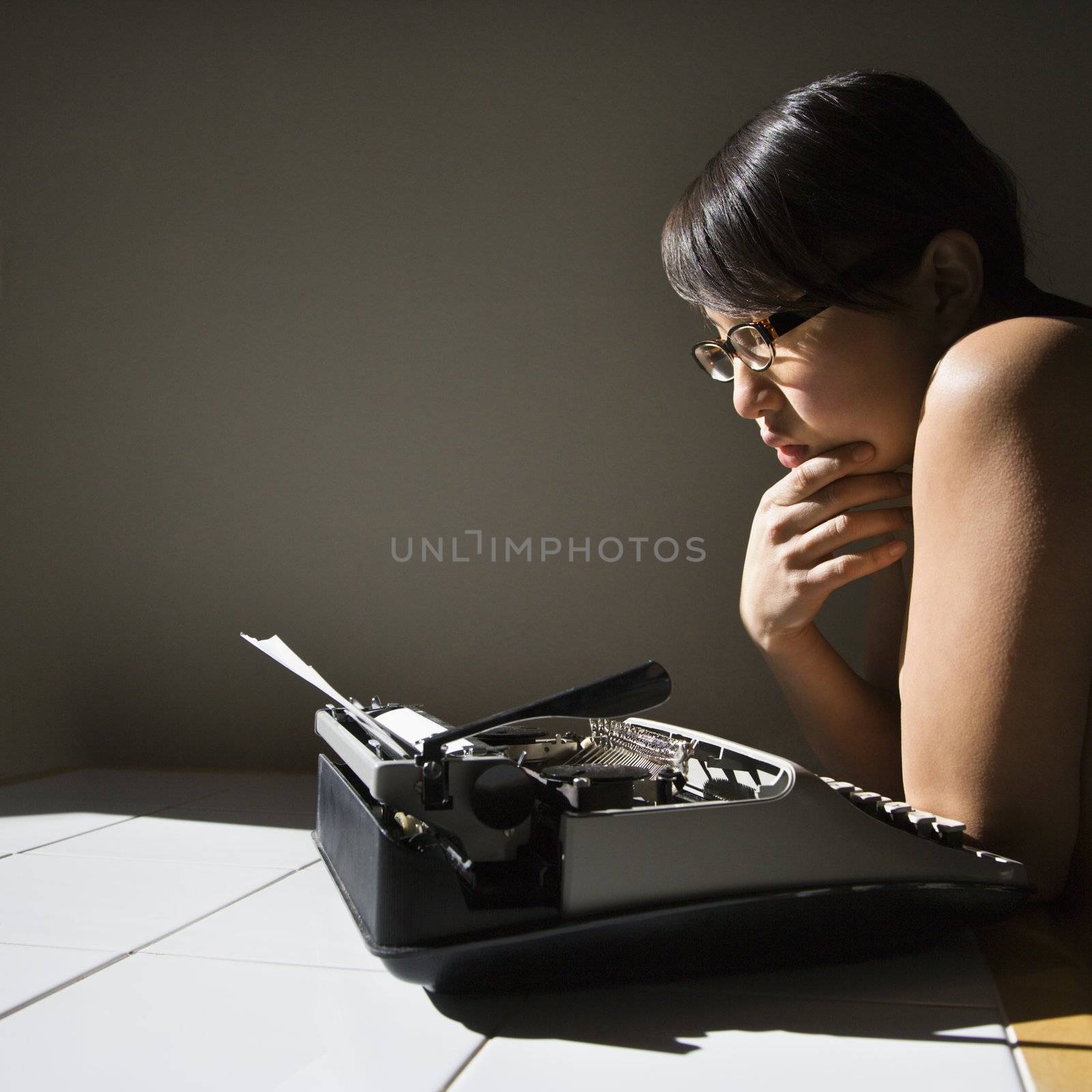 Woman with typewriter. by iofoto