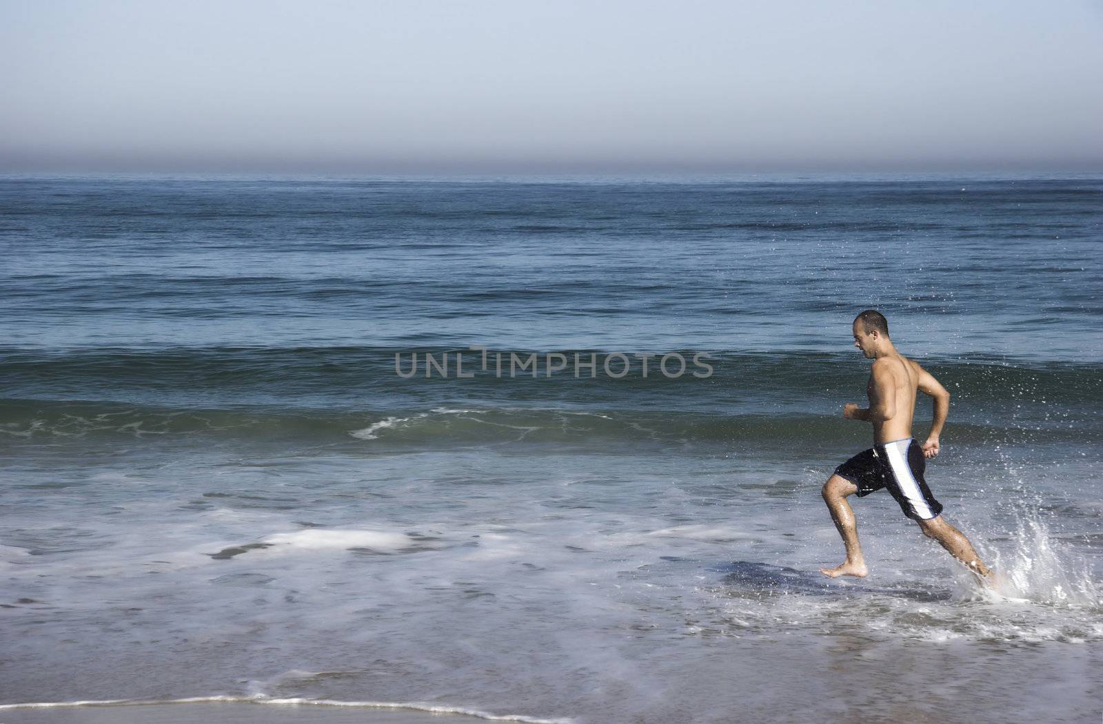 Man doing exercise on the beach