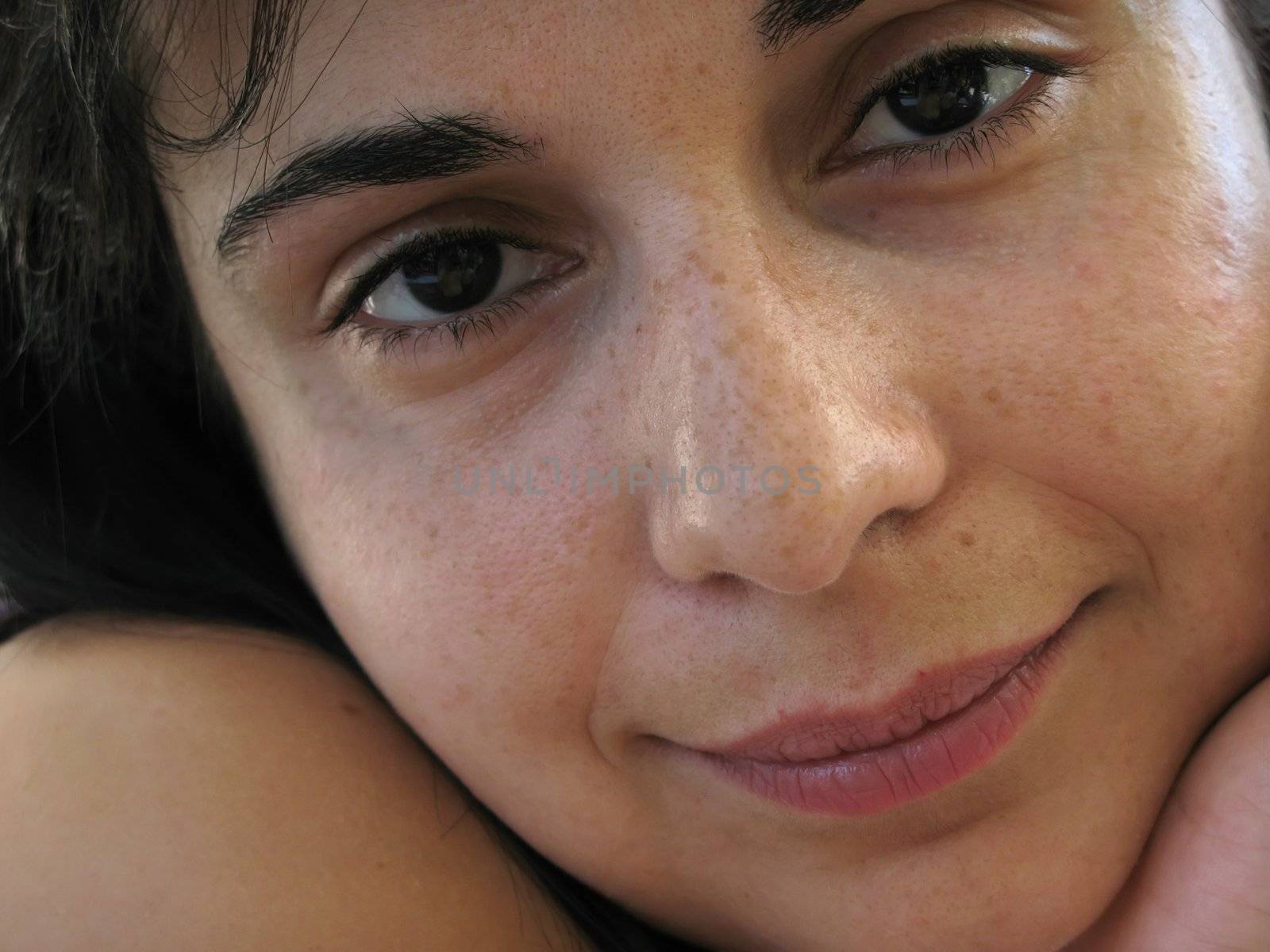 Beautiful young woman face portrait. Close up.