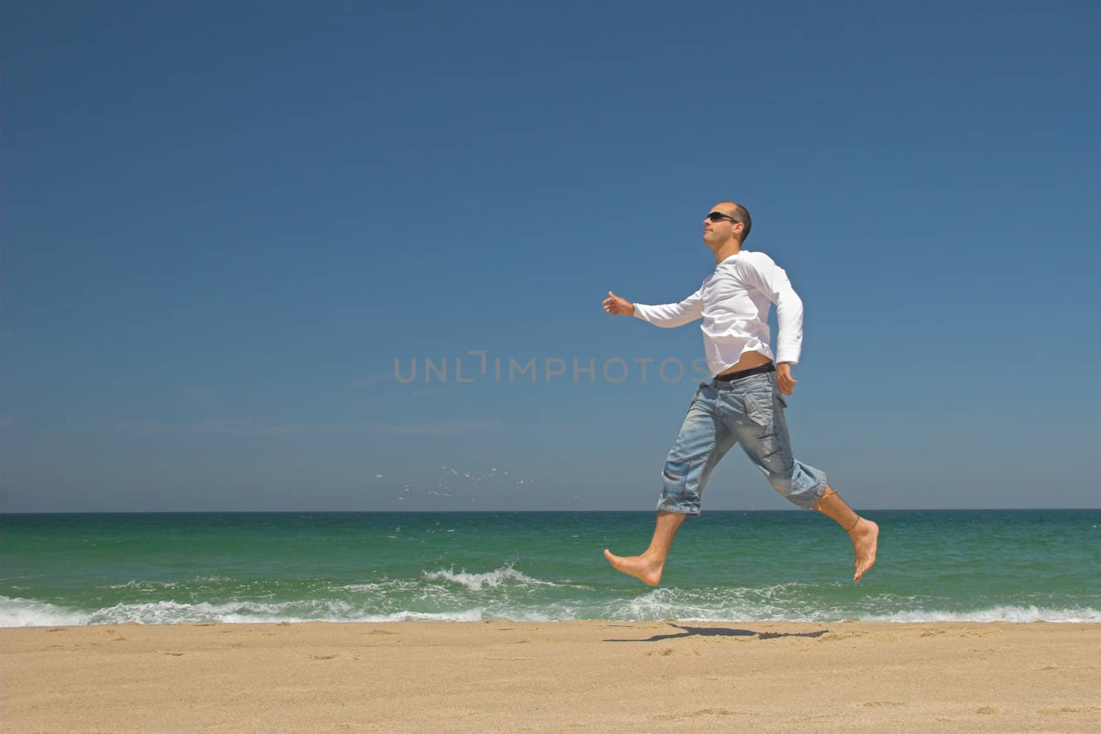 Man jumping on the beach